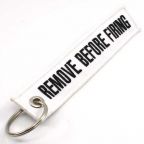 Remove Before Firing Keychain - White/Black